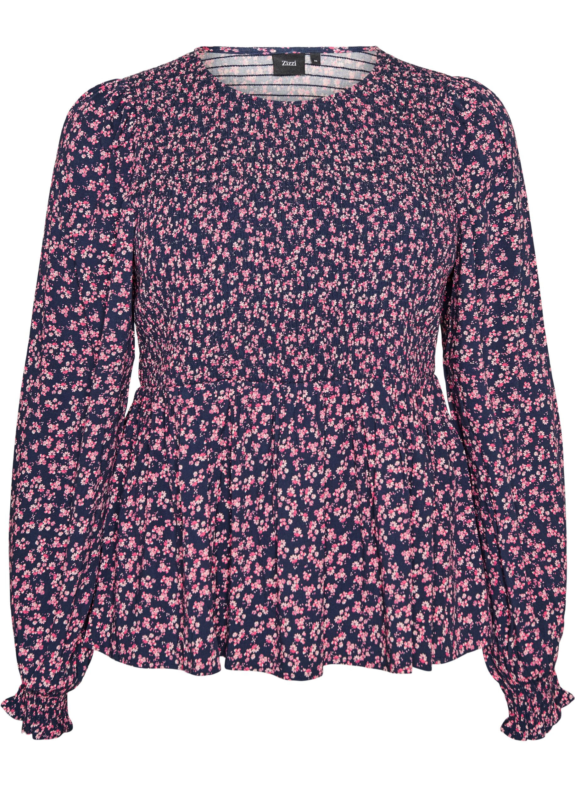 Blus med smock upptill och blommigt m&ouml;nster