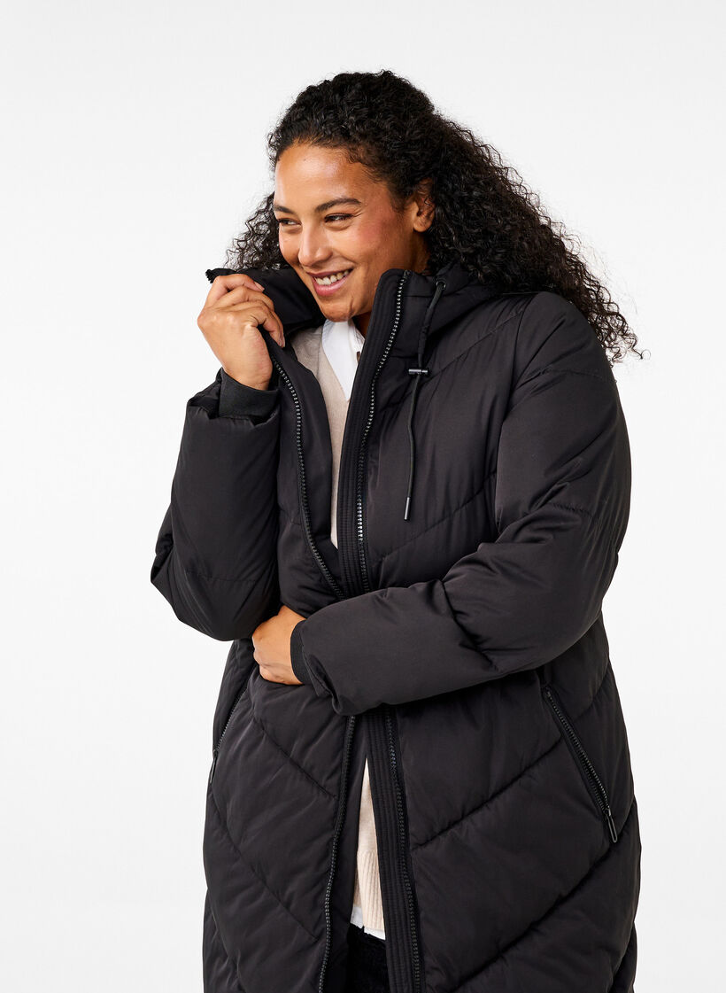 L&aring;ng pufferjacka med huva och fickor, Svart, Model image number 3