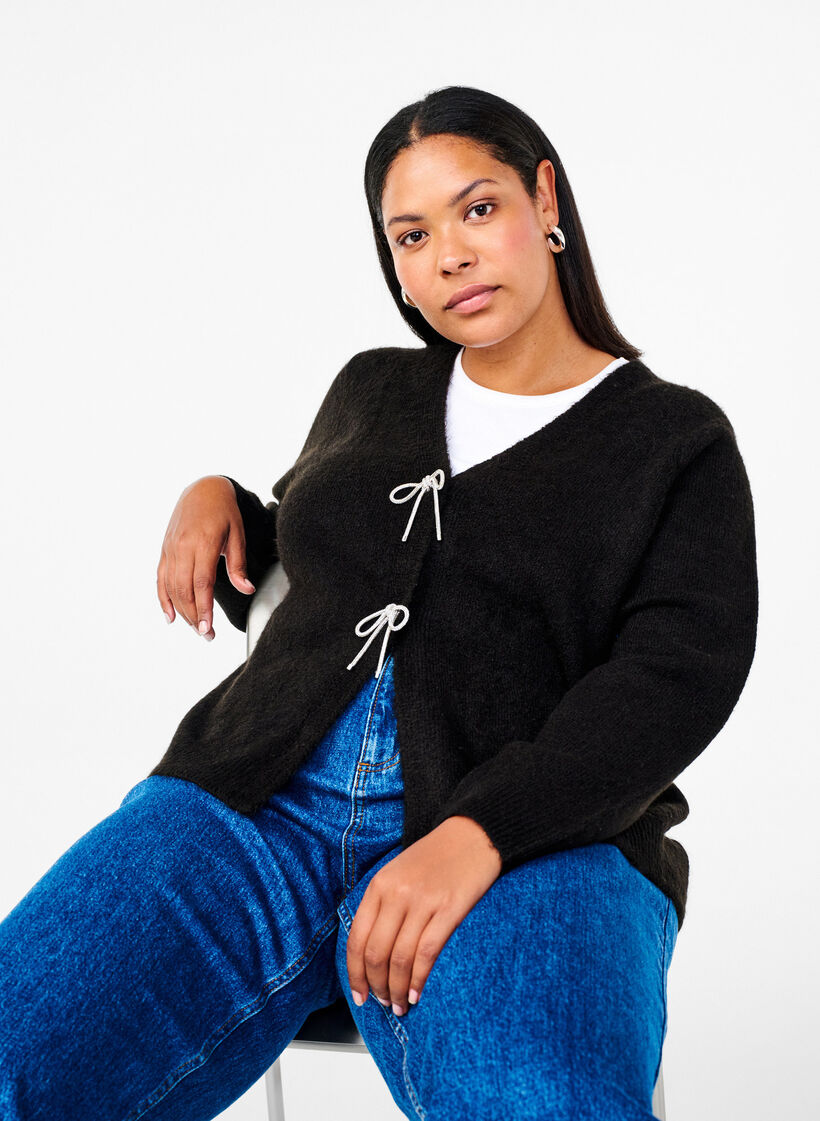 Stickad kofta med silvrig rosett, Black, Model image number 2