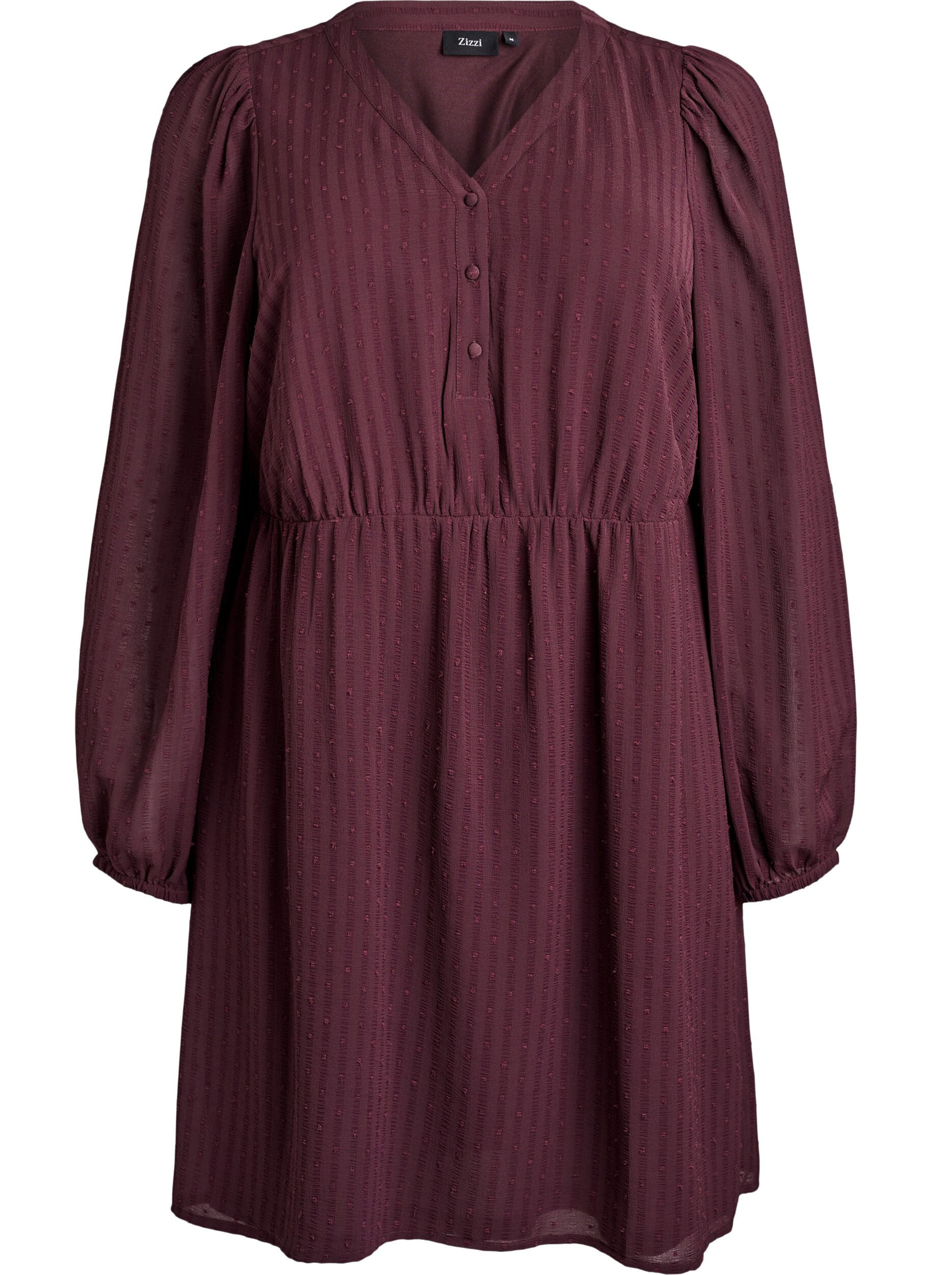 Kort kl&auml;nning med ton-i-ton-r&auml;nder och strukturerade prickar