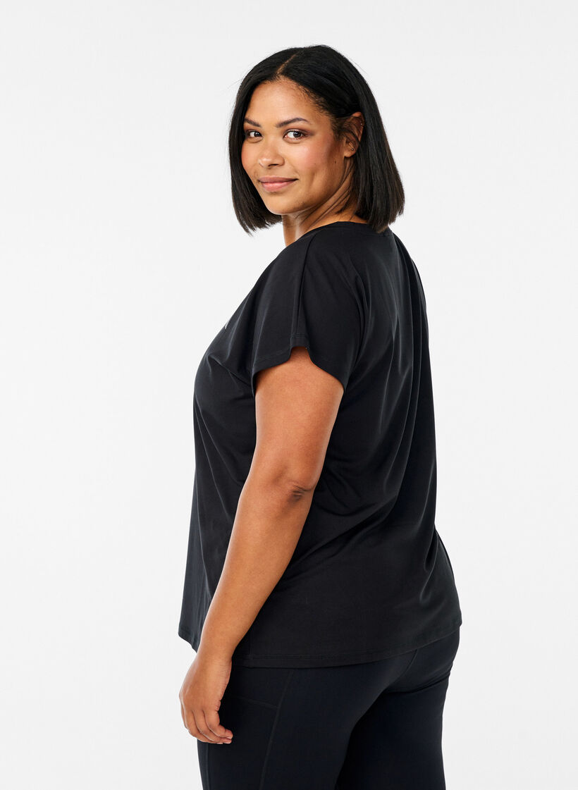 Tr&auml;nings t-shirt med v-ringning och l&ouml;s passform, Svart, Model