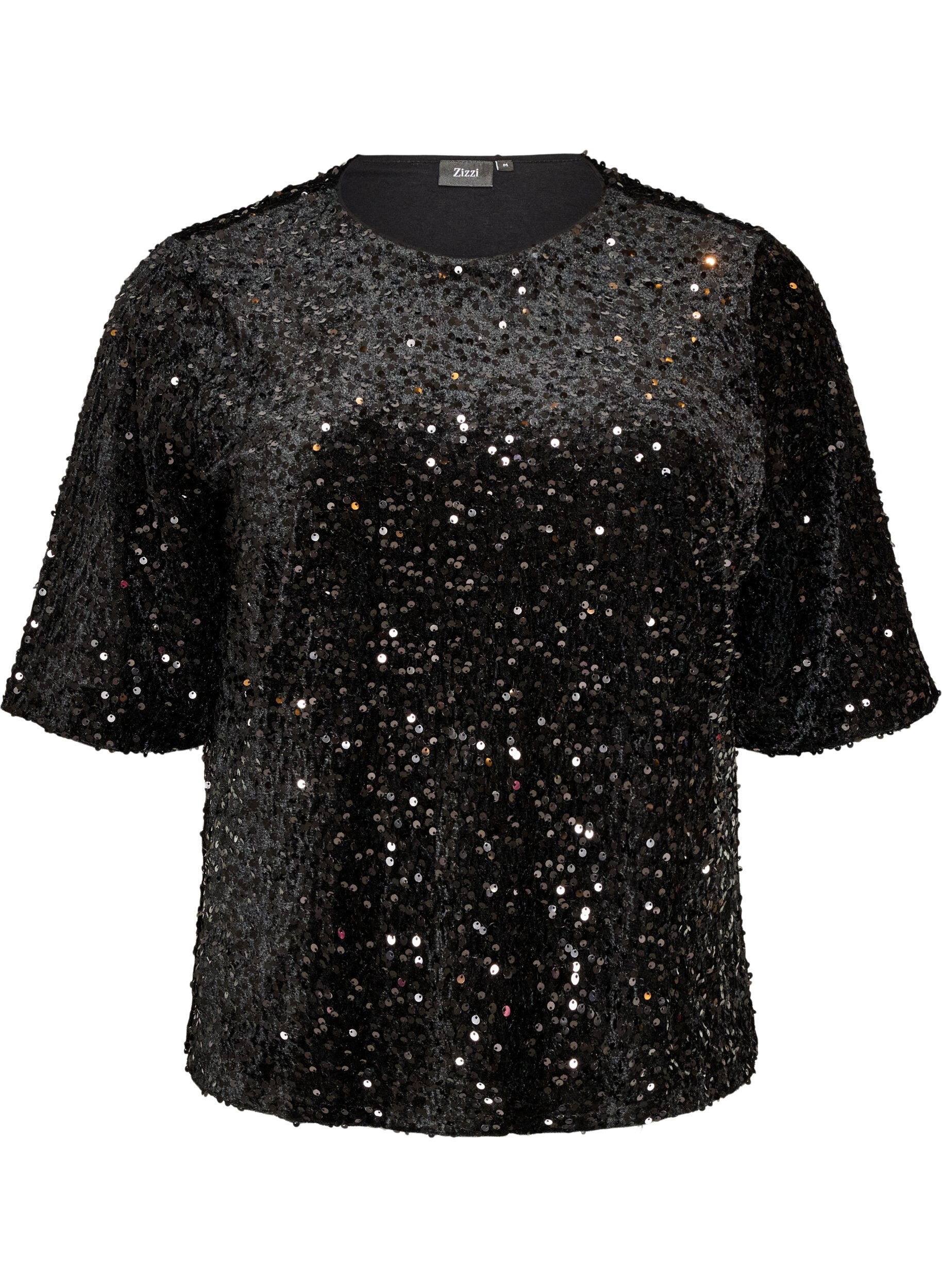 Blus med paljetter och armb&aring;gsl&aring;nga &auml;rmar