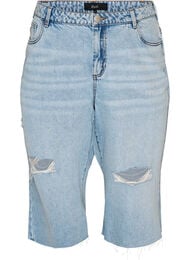 Croppade jeans med en sliten look och r&aring;a kanter, Bl&aring;