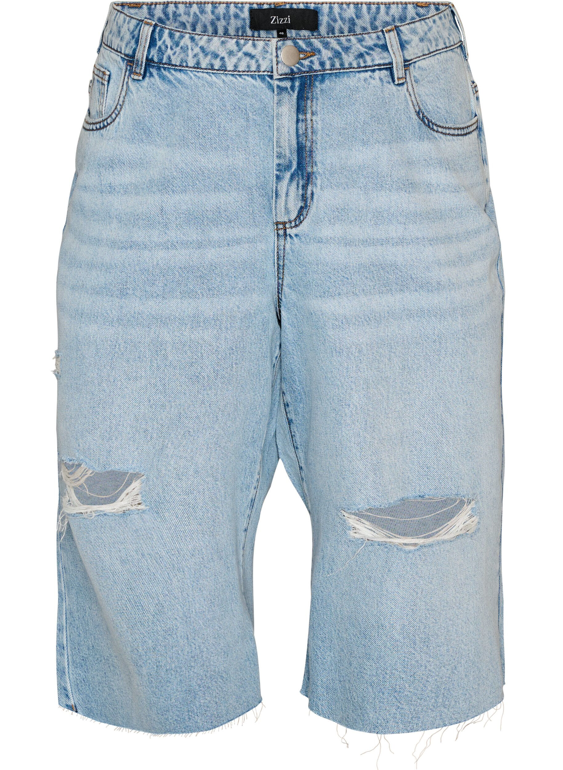 Croppade jeans med en sliten look och r&aring;a kanter
