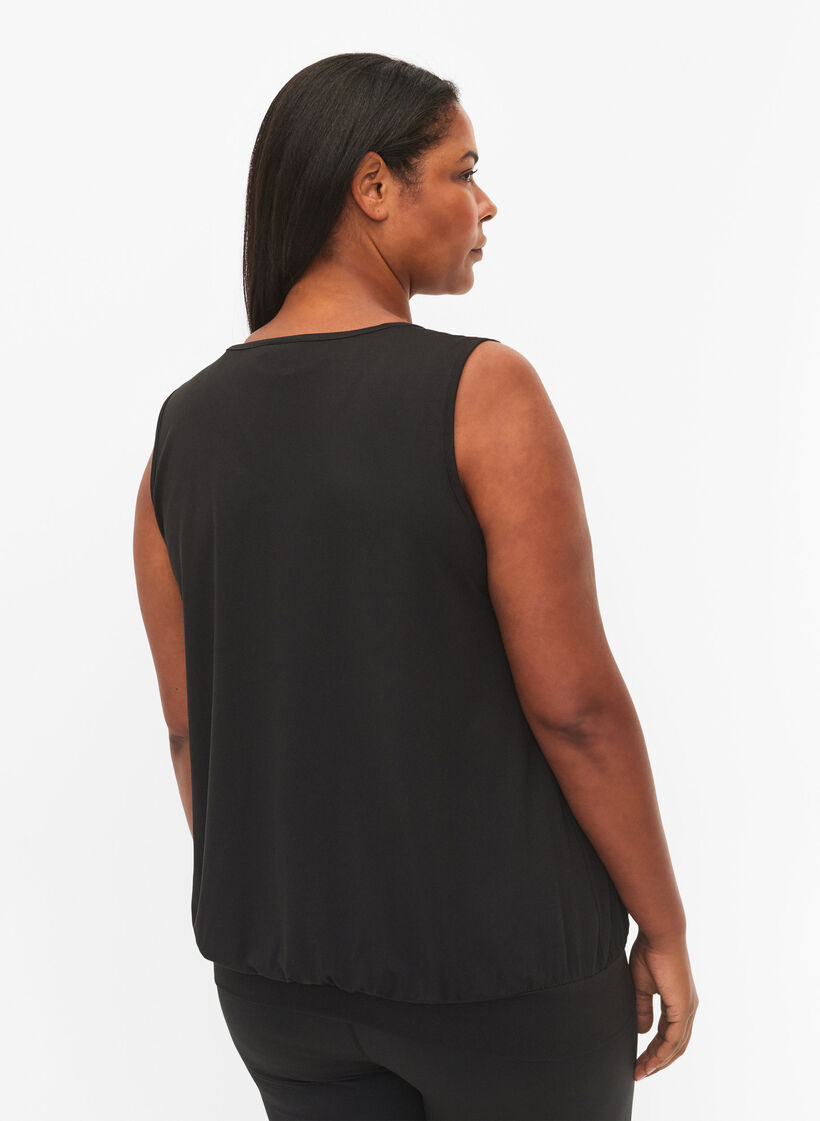 Ärmlös träningstopp med bred fåll, Black, Model image number 1