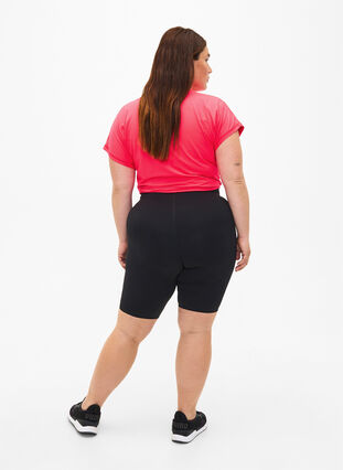 Tight åtsittande träningsshorts med ficka, Black, Model image number 1