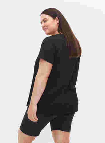  T-shirt till träning med print, Black w. Copper Foil, Model image number 1
