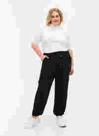 Enfärgade byxor med stora fickor, Black, Model