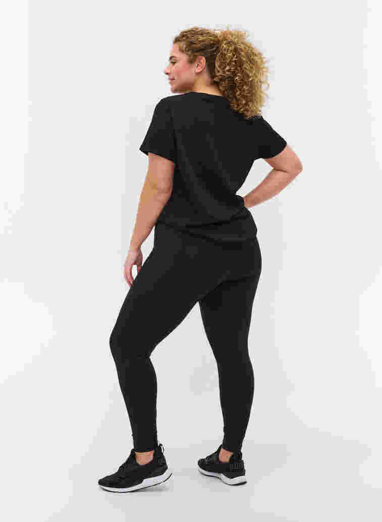 Croppade träningstights med ficka och reflex, Black, Model image number 1