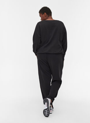 Lösa sweatpants med fickor, Black, Model image number 1
