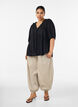 Blus i viskos med prickig textur och v-ringning, Svart, Model image number 1