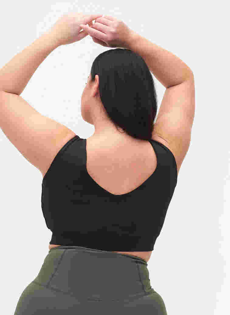 Enfärgad sport-bh med v-rygg, Black, Model image number 1