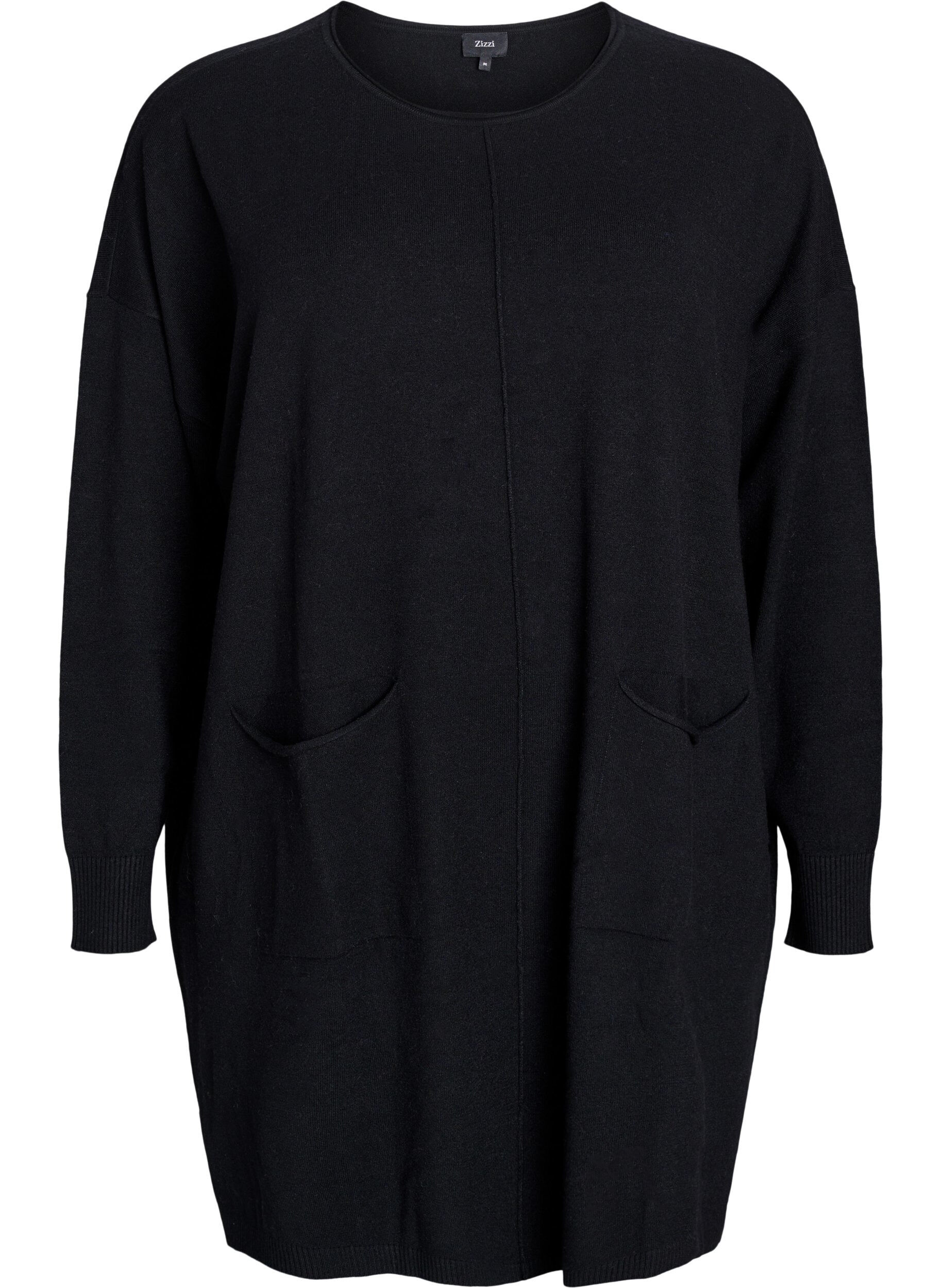 Kort stickad kl&auml;nning med mitts&ouml;m och fickor