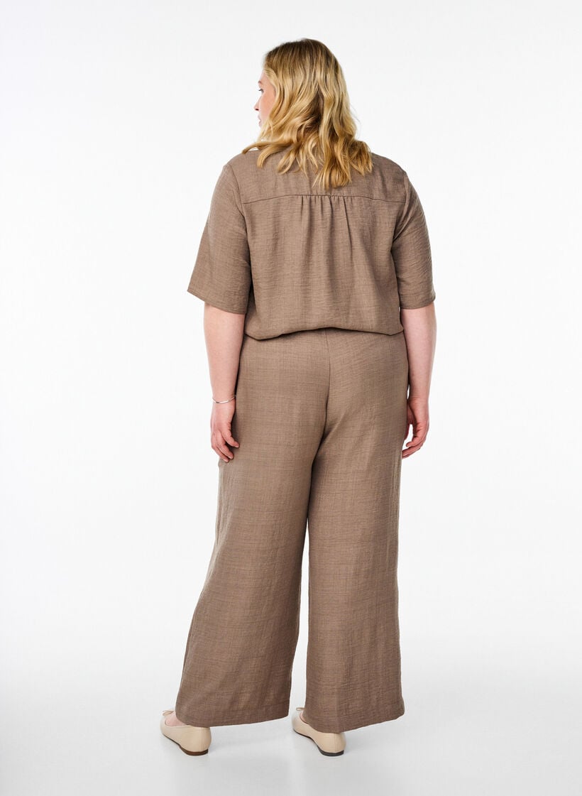 L&ouml;sa byxor med res&aring;r i midjan och fickor, Brun, Model image number 1