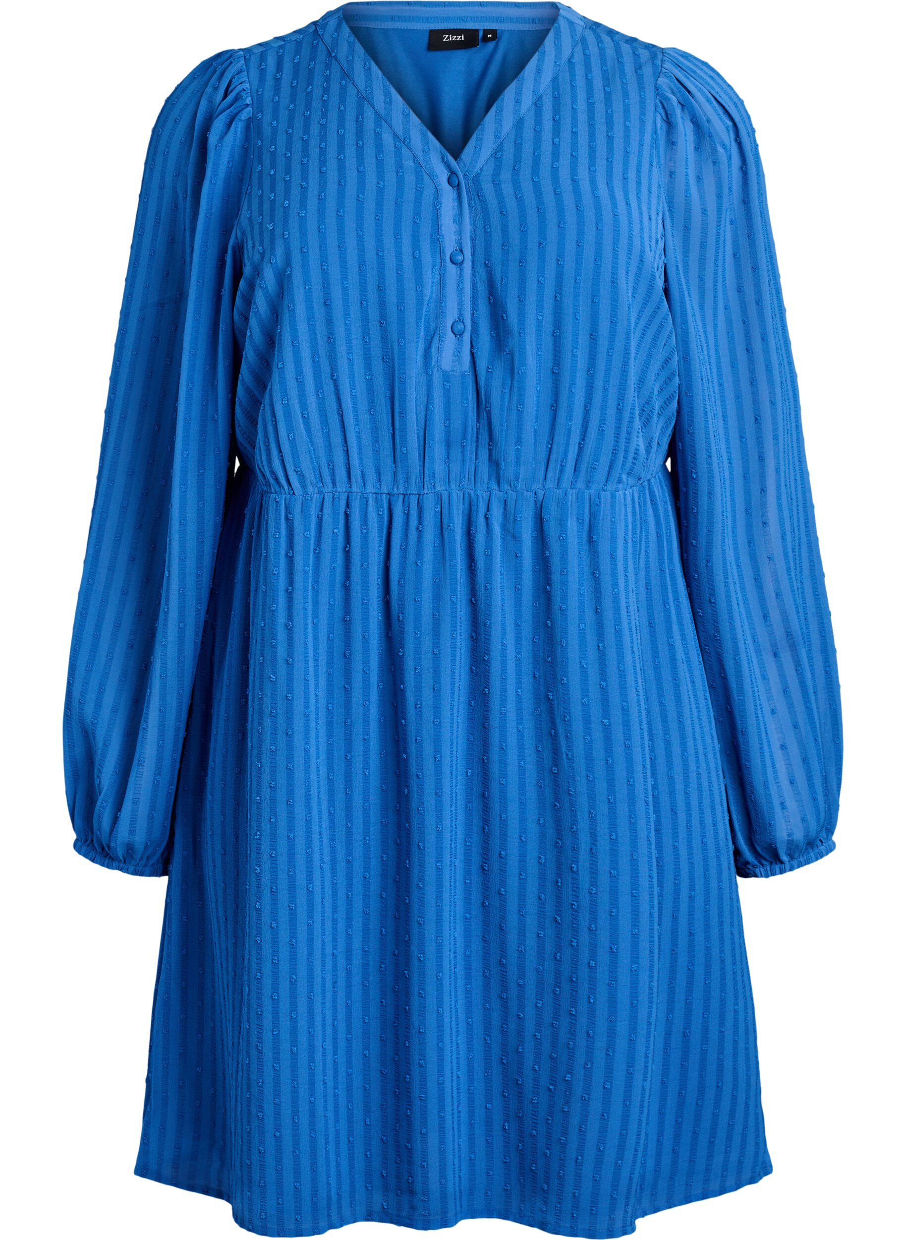 Kort kl&auml;nning med ton-i-ton-r&auml;nder och strukturerade prickar