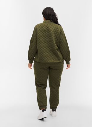 Mönstrade byxor med dragsko och fickor, Ivy Green, Model image number 1