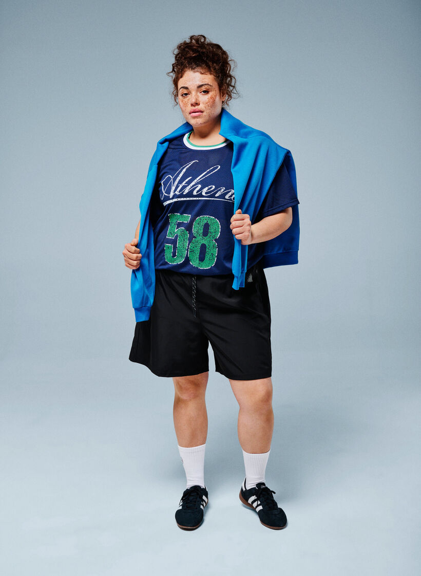 Tr&auml;ningsshorts med innershorts och en mobilficka, Svart, Image image number 0