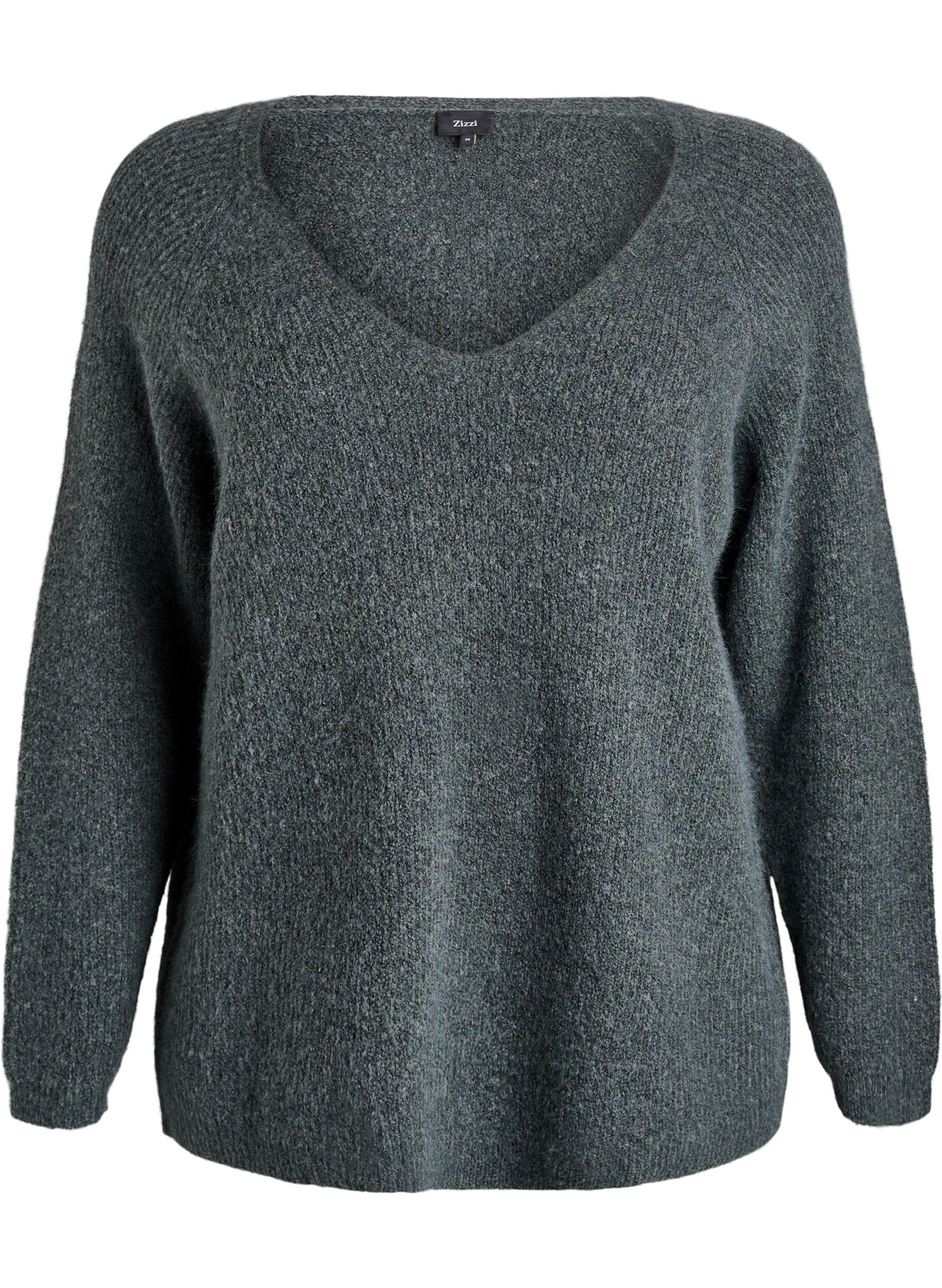 Stickad blus med v-ringning och raglan&auml;rm