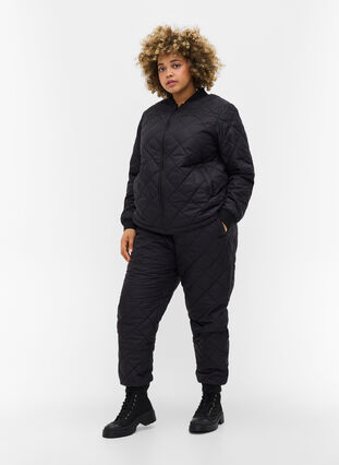 Quiltad 2-i-1 jumpsuit med fickor, Black, Model image number 3