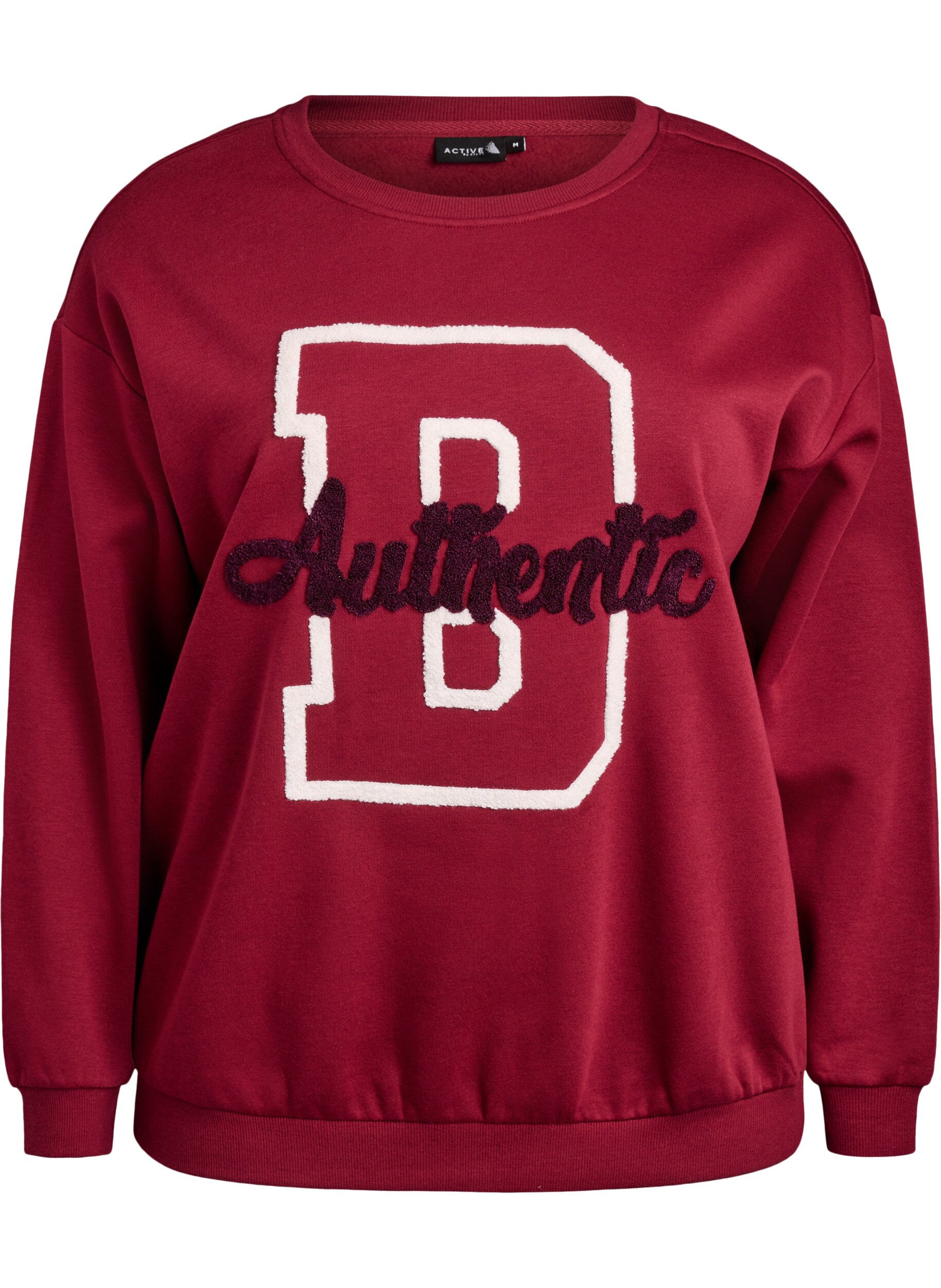 Sweatshirt med frott&eacute;text