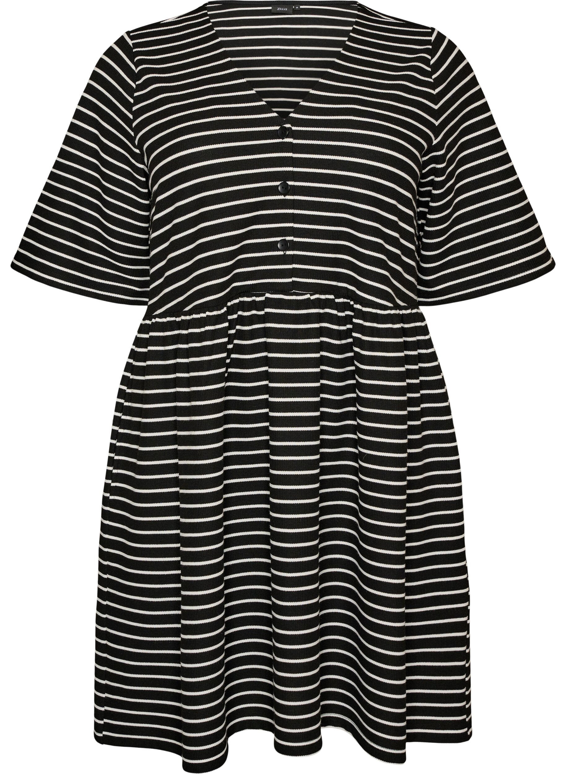 Kl&auml;nning med ribbad textur och empirsk&auml;rning