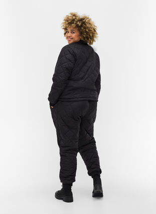 Quiltad 2-i-1 jumpsuit med fickor, Black, Model image number 0