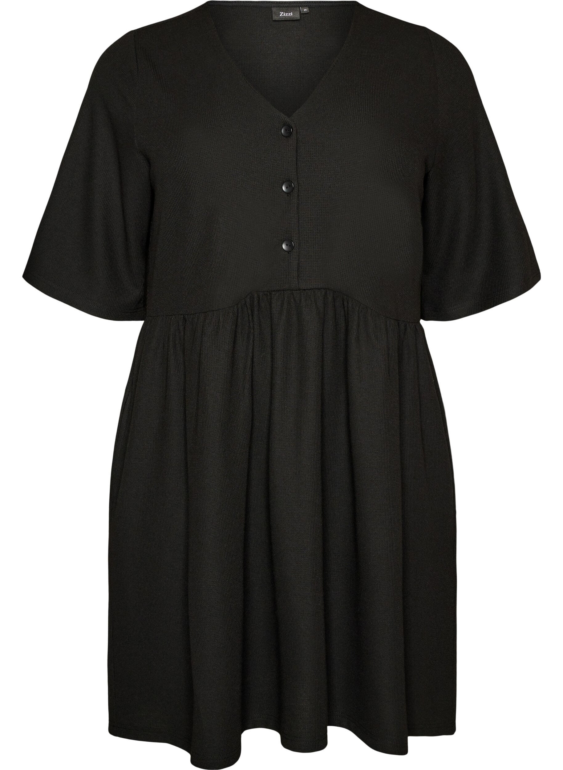 Kl&auml;nning med ribbad textur och empirsk&auml;rning