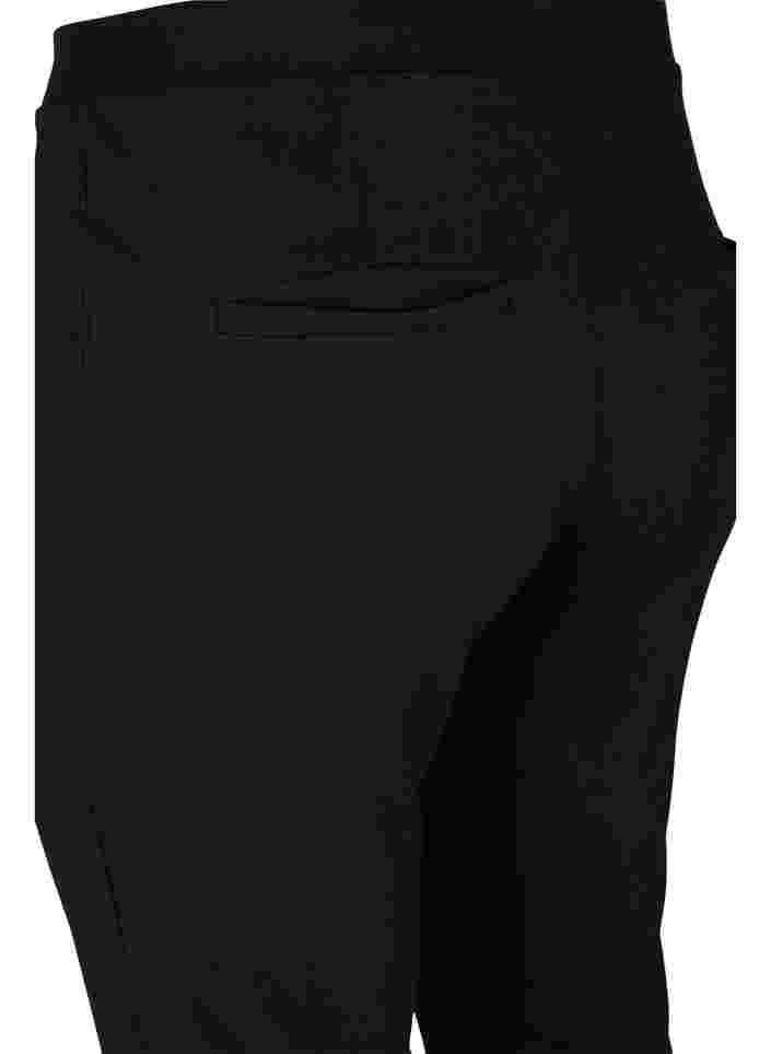 Utsvängd byxa med slits framtill, Black, Packshot image number 3