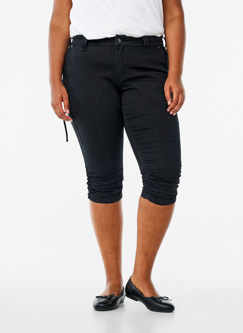 Caprijeans med smal passform och fickor, Svart, Model image number 1