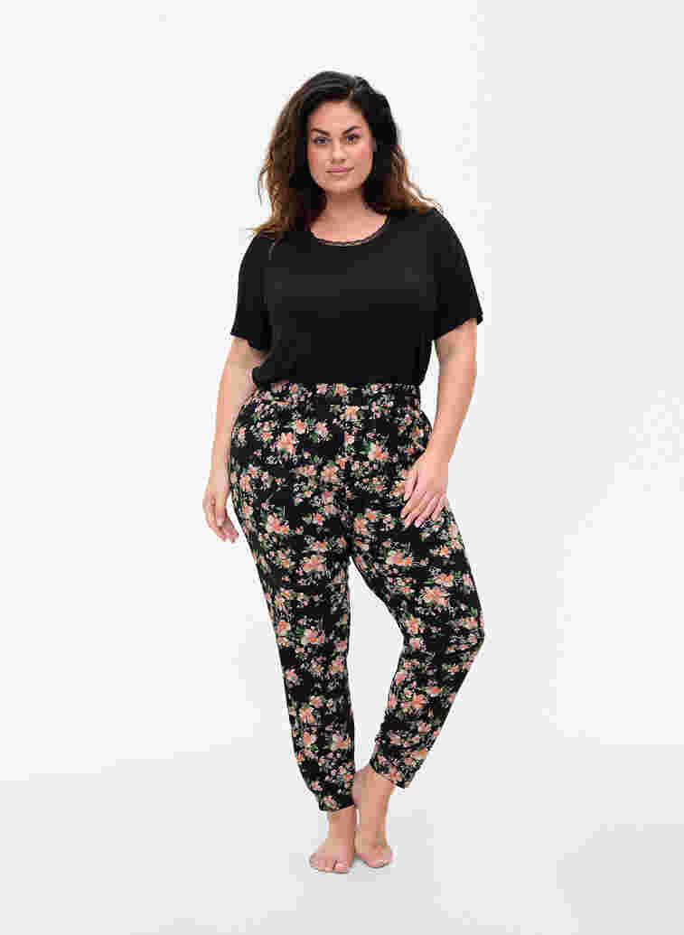 Pyjamasbyxor med blommigt mönster i bomull, Black Flower, Model image number 0