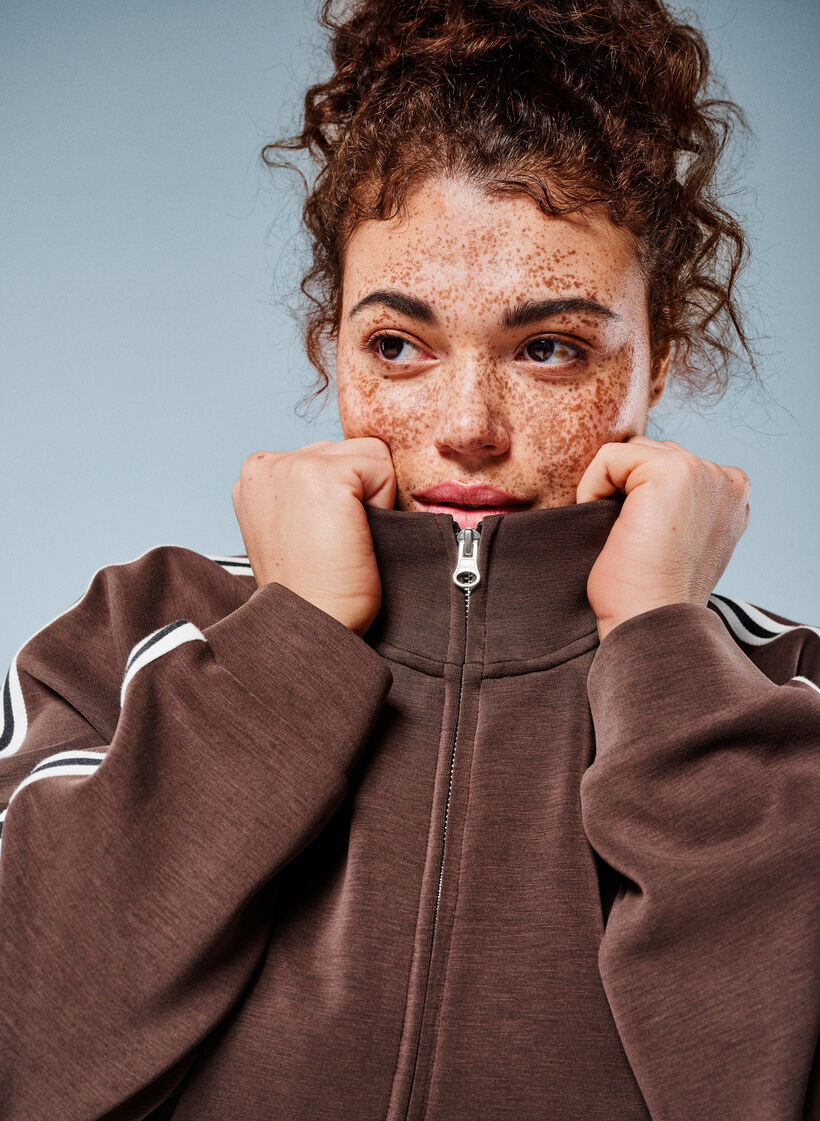 Tr&auml;ningstopp med h&ouml;g hals och r&auml;nder p&aring; &auml;rmarna, Brun, Image image number 0