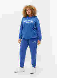 Sweatpants med cargofickor, Dazzling Blue, Model
