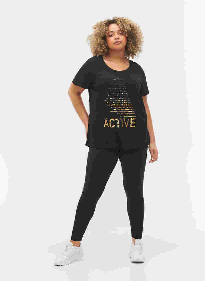  T-shirt till träning med print, Black gold foil logo, Model image number 2