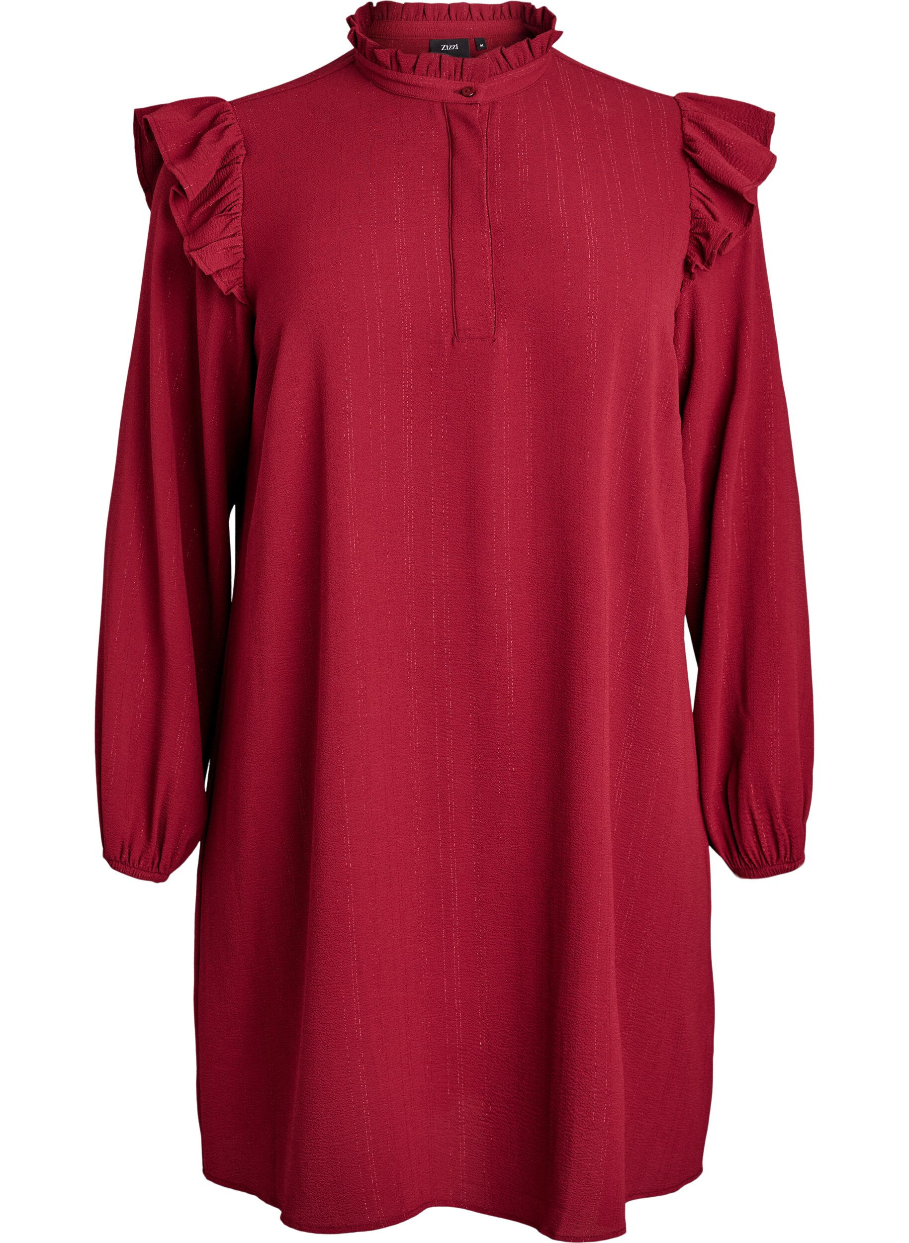 Kort kl&auml;nning med volanger och glitter