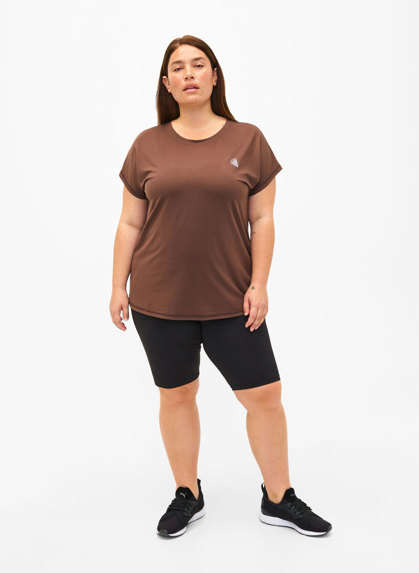 Tight åtsittande träningsshorts med fickor, Svart, Model image number 1