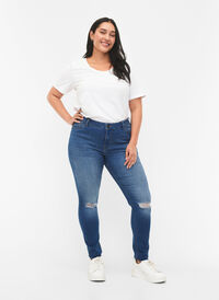 Extra slimmade Sanna jeans med förstörd stil, Blue denim, Model