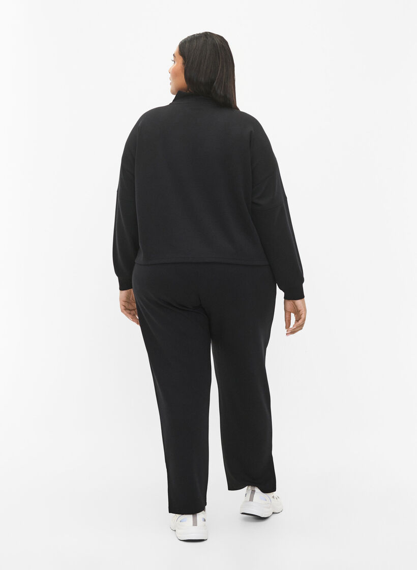 Byxor i modalblandning med slits, Black, Model image number 1