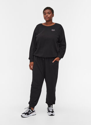Lösa sweatpants med fickor, Black, Model image number 0